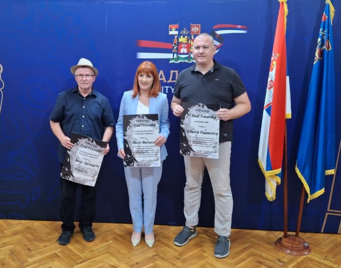 ЗАСЛУЖЕНО... Јан Шпрингел (први с лева) у друштву са још двоје добитника